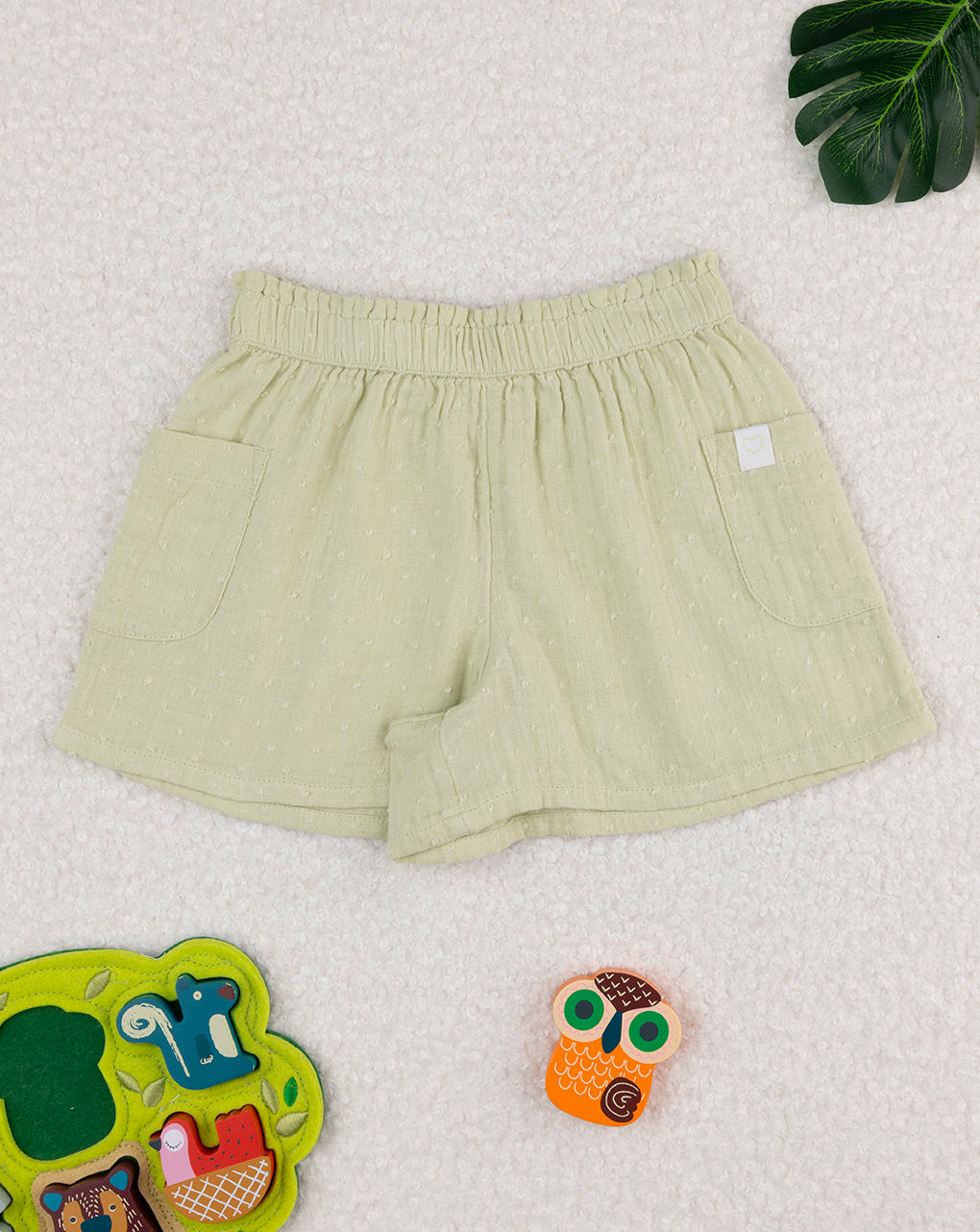 Shorts bimba verde con tasche