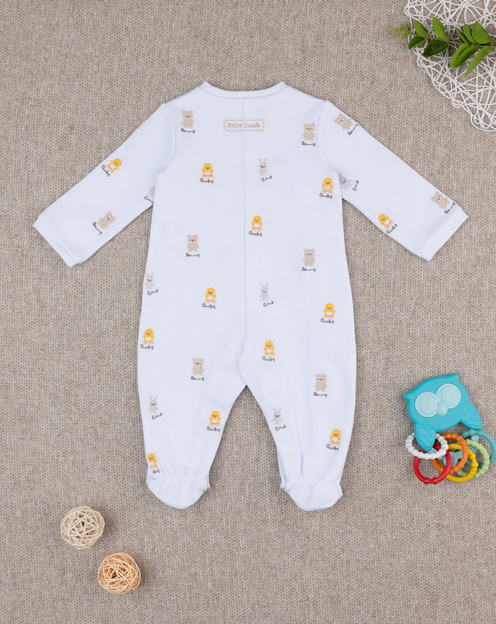 Tutina unisex smile ricami allover